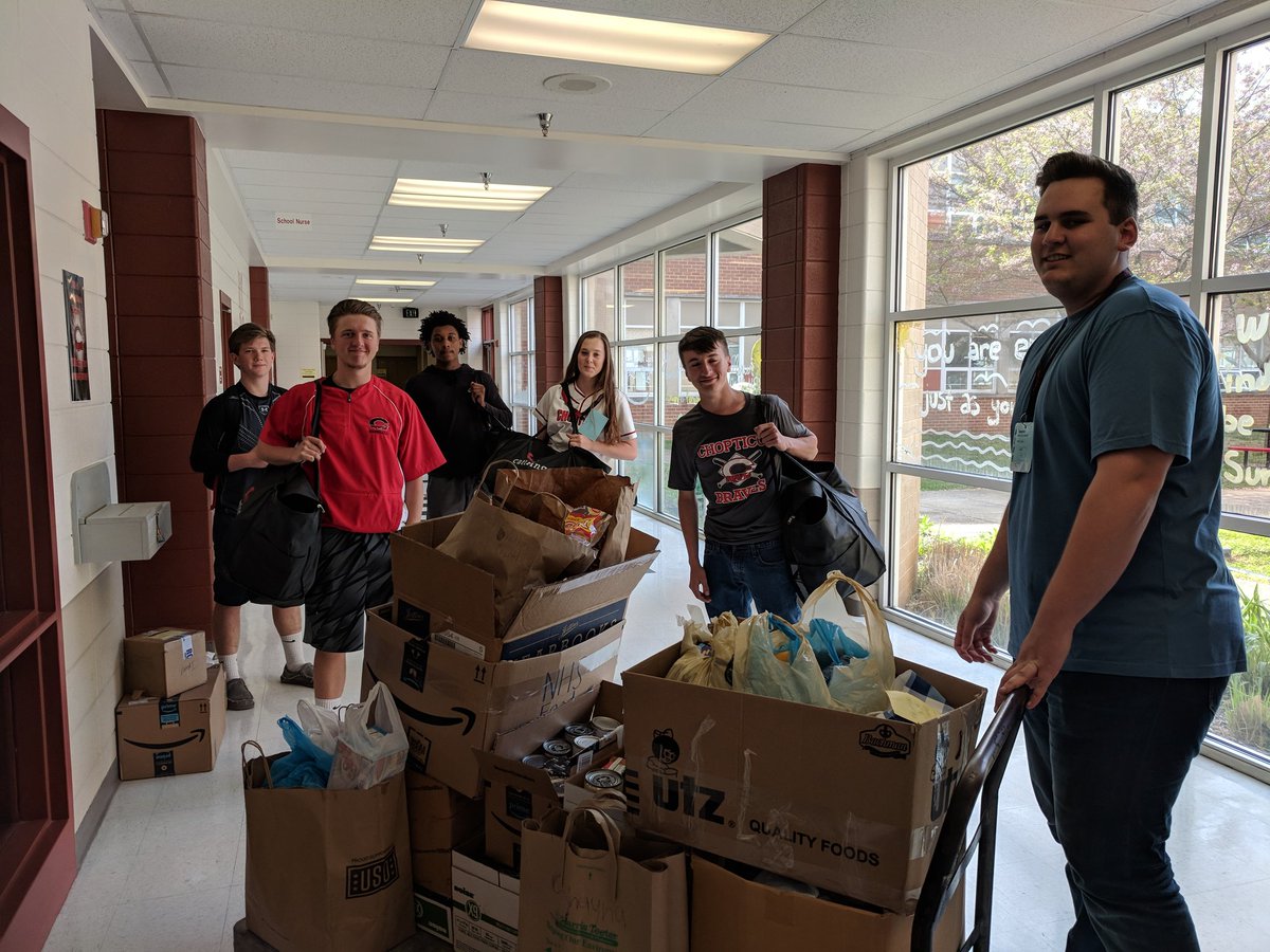 Students loading up food gathered by NHS to support the food program at Mt. Zion Church.