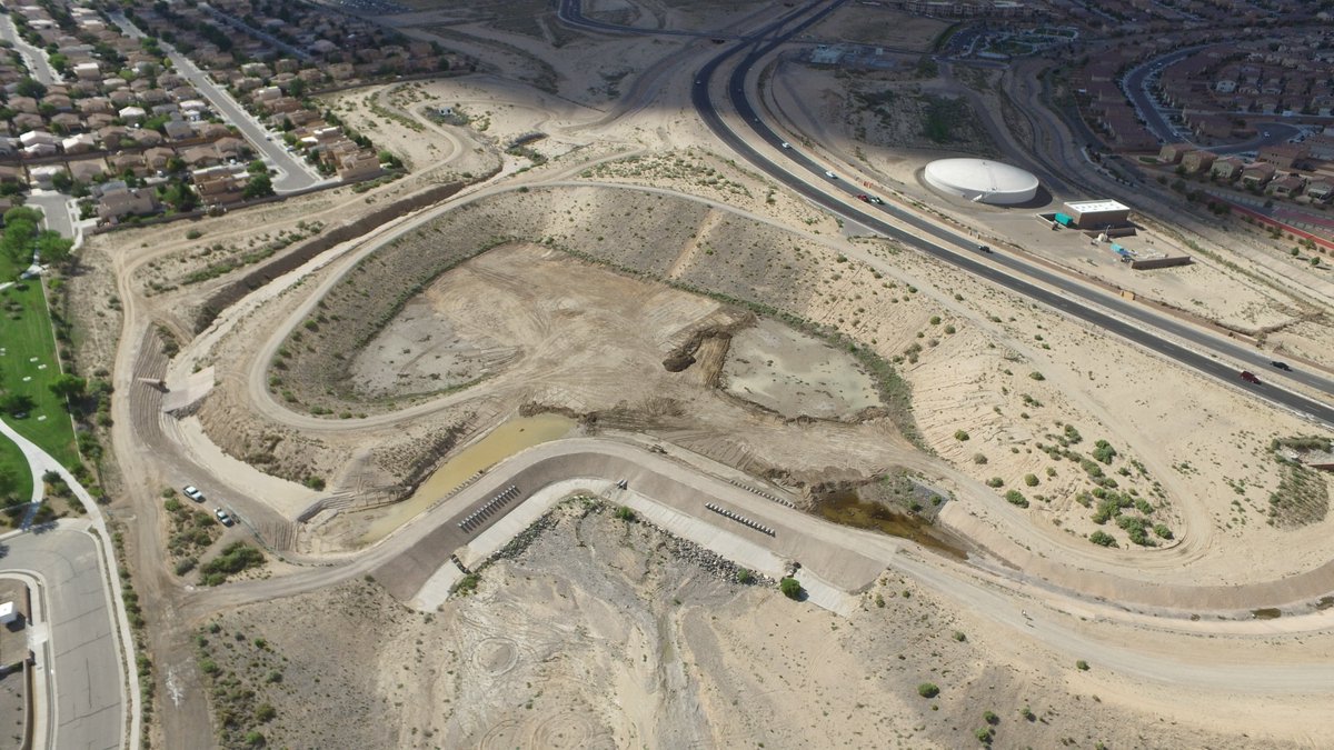 ABQFloodControl's tweet photo. #AMAFCA #FavoriteFacilityFridays This week we asked our newest Engineer Jared Romero! Jared chose Black Arroyo Dam to be his personal favorite. He said this project was really cool as it is a dam within a dam. Thanks Jared! Stay tuned next Friday! https://t.co/Ac9P834J2e