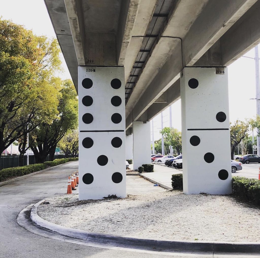 GoMiamiDade's tweet photo. Have you passed by our Metrorail columns lately and noticed some are starting to look like dominos? Local artist Bo Droga’s latest #publicart work is called “Concrete Landscapes Miami,” in which he transforms our pylons into playful, realistic domino game pieces. #GoMiamiDade https://t.co/Q5EhgiwUwo