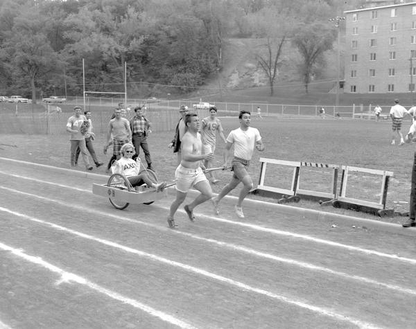 MNSUMankato's tweet photo. It's currently #Greekweek so we thought this week's #FlashbackFriday was appropriate. This photo shows a Greek week chariot race at Mankato State College in 1967! https://t.co/Ch89wy4clm