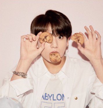 LuvMissWhitney's tweet photo. Kookie eating cookies is the cause of my EUPHORIA. 🍪 #ARMYSeIcaDay #arsd @BTS_twt https://t.co/5owCXI4V1g