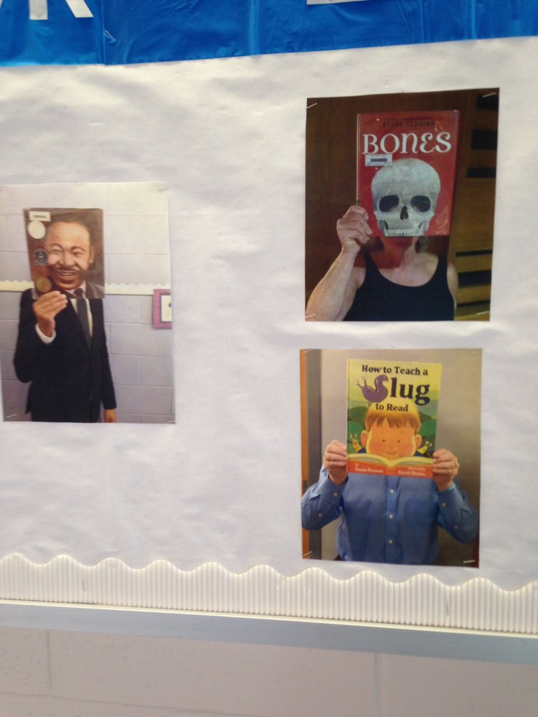 HessSchoolIMC's tweet photo. This month's bulletin board- Library Facebook. Thanks to everyone who helped!  I know you were smiling behind your book 😉 #WeAreHess @HessHornets https://t.co/6iSbKimDAm