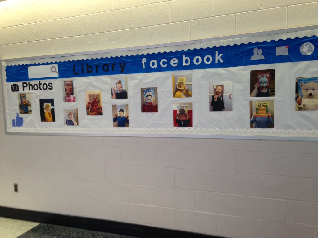 HessSchoolIMC's tweet photo. This month's bulletin board- Library Facebook. Thanks to everyone who helped!  I know you were smiling behind your book 😉 #WeAreHess @HessHornets https://t.co/6iSbKimDAm