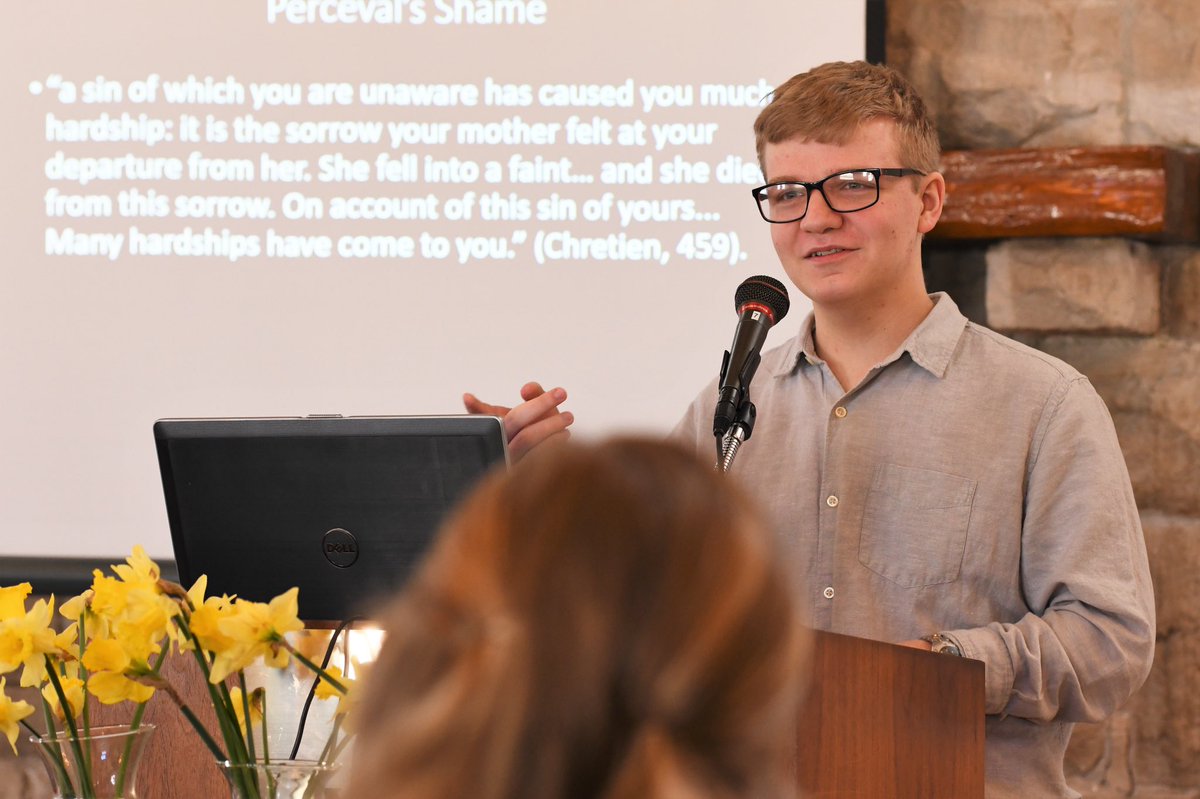 HistoryDeptWKU's tweet photo. History major Anakin Cary discusses his research on chivalric romances at the History Undergraduate Research Conference. Well done! #HURC @WKUPcal #ClimbWithUs https://t.co/qrIHMYE1p6