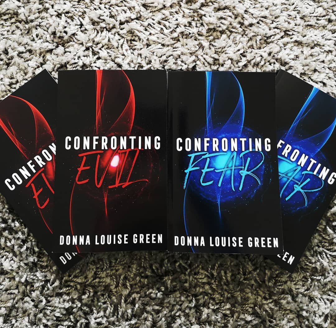 DLG_author's tweet photo. This is the first time I've actually seen physical copies of my books with the new cover design. I love them! 😍 #newcover #books #coverdesign #ConfrontingEvil #ConfrontingFear https://t.co/CbvrLQpNP4