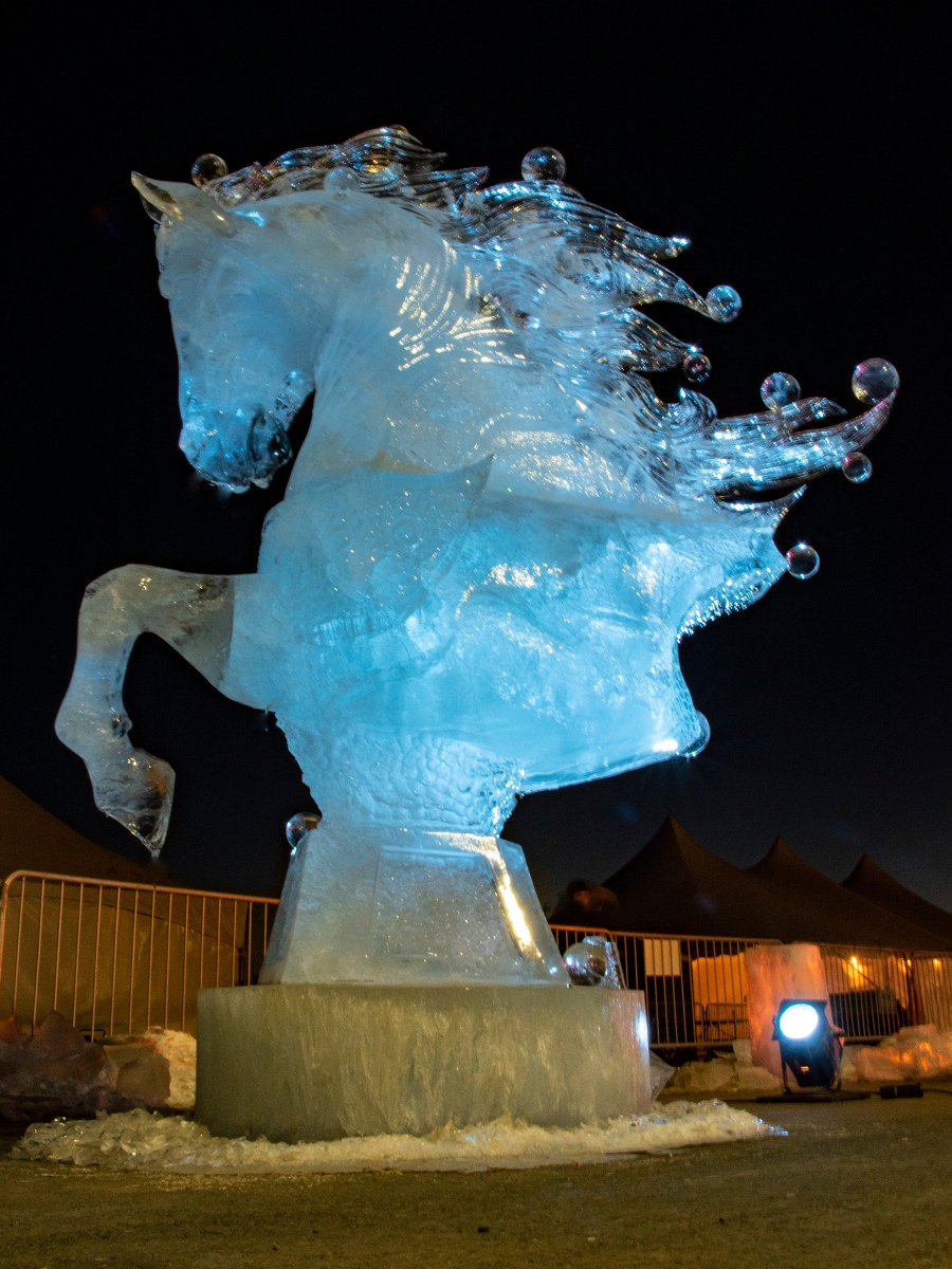 Glowing blue under a spotlight, Unbridled, a work by Aaron Costic and Matthew Stoddard, won second place at the 7th annual #DeBeersInspiredIce international ice carving competition in #Yellowknife on the weekend. <a href="/spectacularNWT/">Spectacular NWT</a>  #LJJ2019