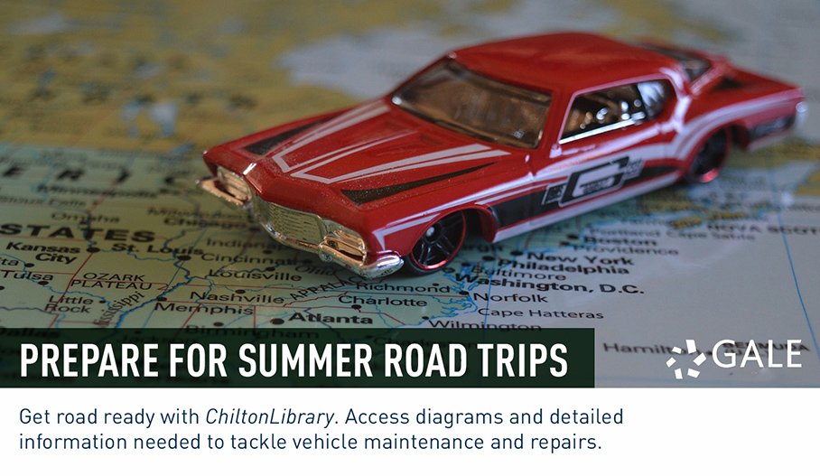 a toy model of a 1950s car sitting on top of a map