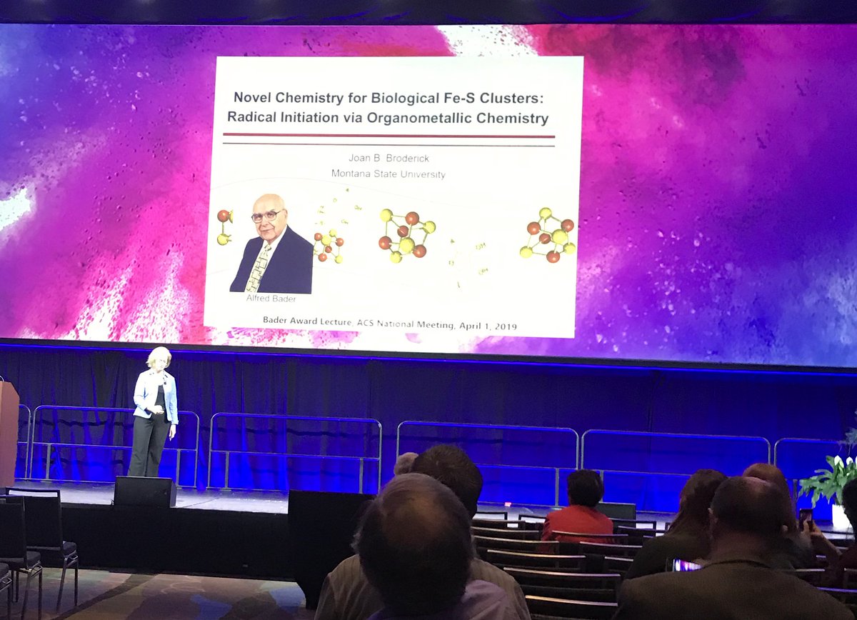 IONiCCu's tweet photo. Joan Broderick (@BroderickLabFeS) presents her talk as the award winner of the 2019 Alfred Bader Award.  #acsdic #acsorlando https://t.co/ycr0qyzhh8