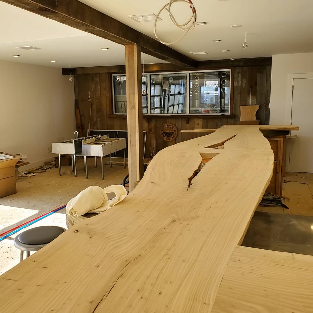 SaggDistillery's tweet photo. And so the ants keep marching... Inch by inch, we're getting our tasting room closer to completion. The bar top is from a local Elm tree. Reclaimed wood adorns the bar and walls. We poured our patio today. Progress https://t.co/yeB5Xreoyd
