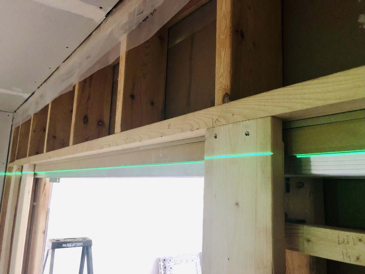 Installing tracks for pocket doors. Green laser comes very handy when it comes to proper leveling. #fivestarmoulding #pocketdoors #interiordoors #doorsofinstagram #doors #pocketdoorsystem #leveling #greenlaser #construction #carpenter