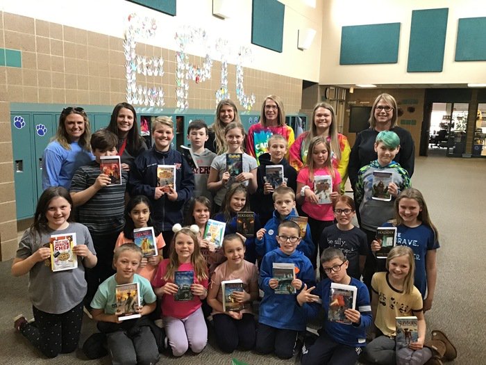 ElemJourney's tweet photo. Student teacher, Miss Horkey, and her 4th-grade class had special visitors in memory of her close friend, Cat, who was also an elementary education major. Mrs. Olson, Cat’s mom, wanted to share her story and give learners books to take home in memory of her daughter. https://t.co/kO7C6J4Mwx