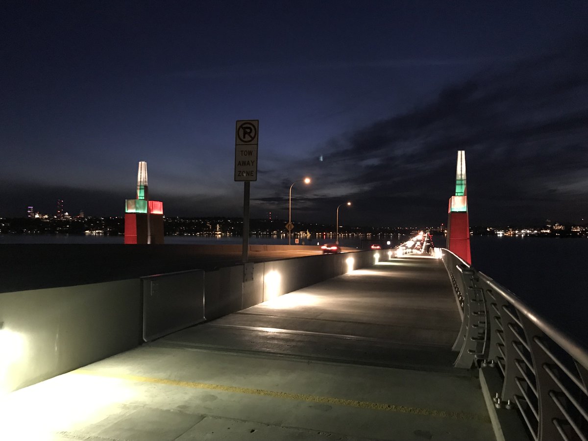 The 520 bridge sentinels shine red and green at night