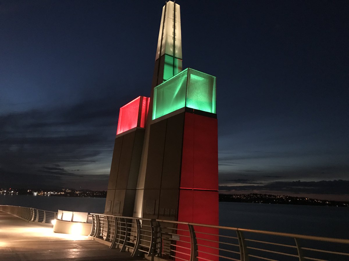 The 520 bridge sentinels shine red and green at night
