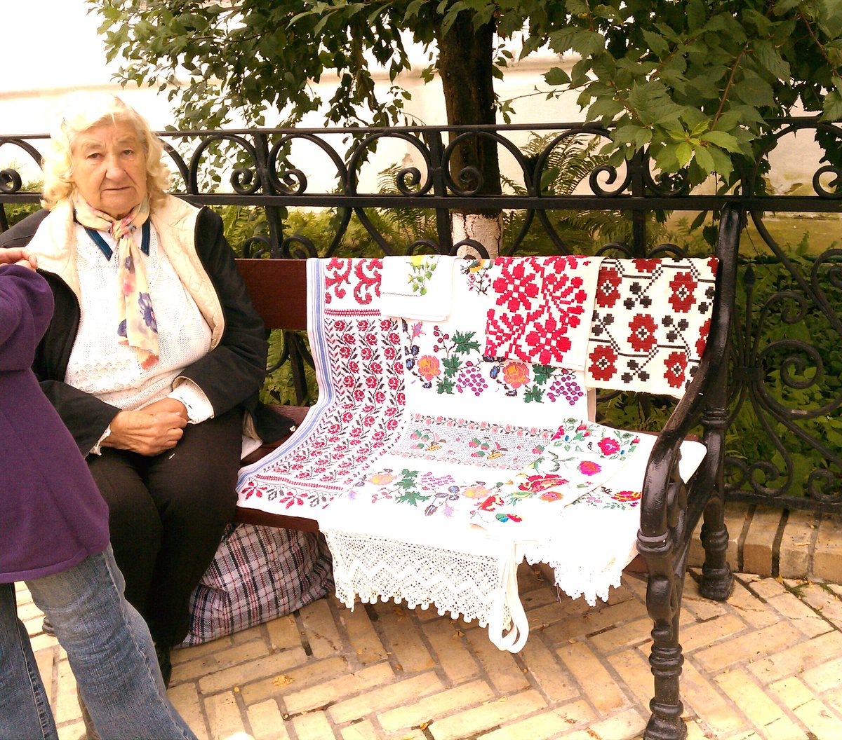 Lovemyskinsoaps's tweet photo. At Russian monastery: an old lady sells her needlwork. #folk #embroidery #needlework #Russian #monastery #crossstitch #colorful #handmade #stitching #towels https://t.co/MUDiOILjAW