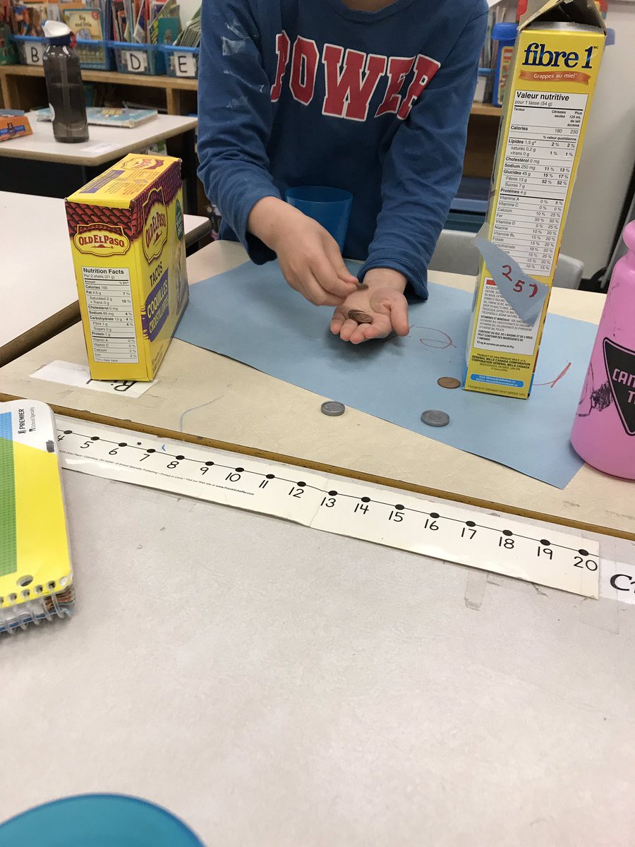 a_smithed's tweet photo. Practicing buying and selling products by making our own stores. Grade 1s showing their knowledge of money, addition and subtraction. #HandsOnMath https://t.co/an268ezNLI