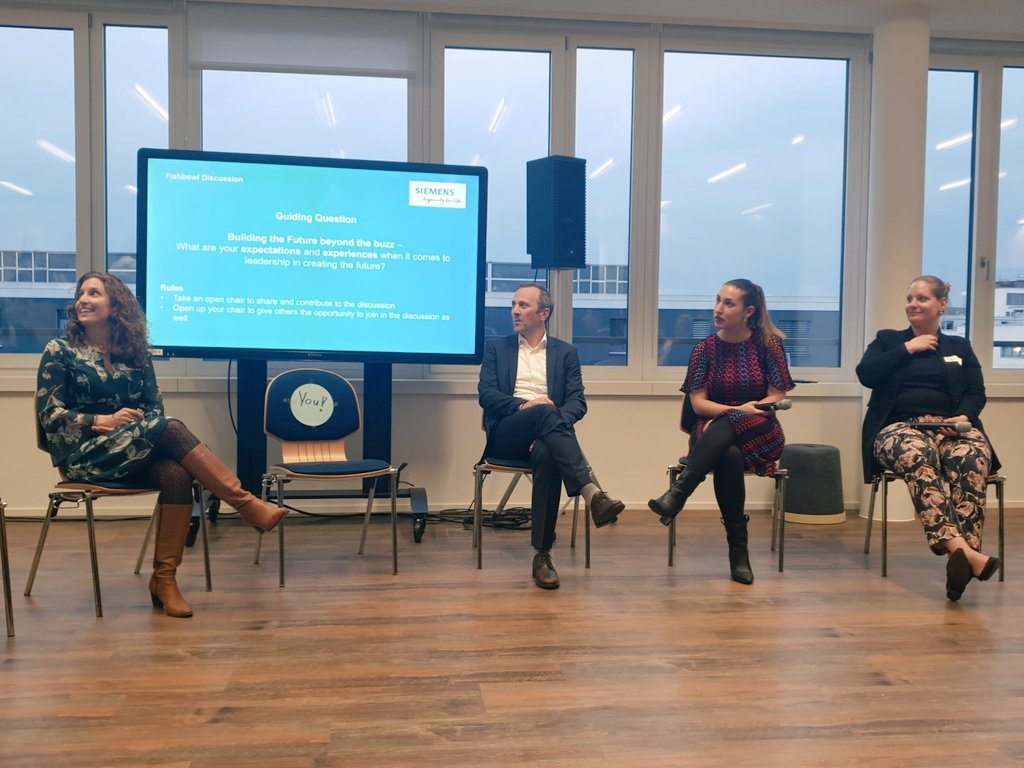 gd_women's tweet photo. The first question for our fishbowl discussion is: what are your experiences and expectations when it comes to leadership in creating the future? The empty chair is waiting for YOU to join the discussion with Alex Senn, @TijenOnaran, Irina & @DolakFranziska #GDWxSiemens #GDWinCH https://t.co/exJegT420W