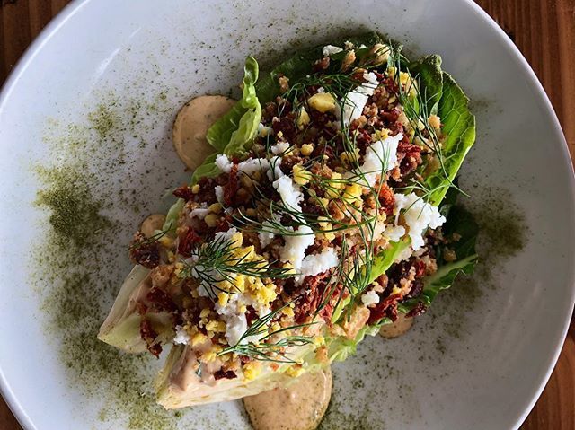Little Gem Salad new on the menu has herb buttermilk dressing, bacon, oven dried tomatoes, garlic croutons, sieved egg, green onion, olives and dill. 📸: @mattdaughaday