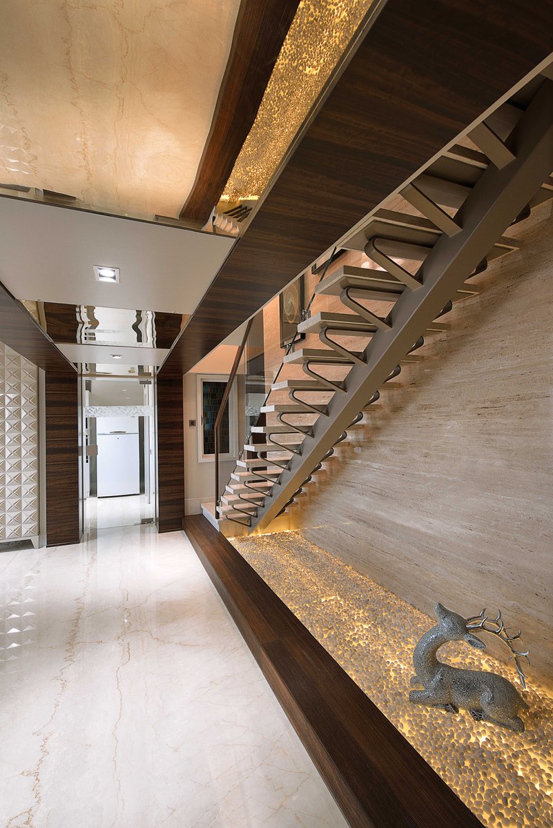 A staircase design that transforms a functional architectural element into a sculptural statement within the interior scheme.
#HSDesiigns #mumbaidesignfirms #publishedworks #impressivedesigns #interiordesign #livingspacesgoals