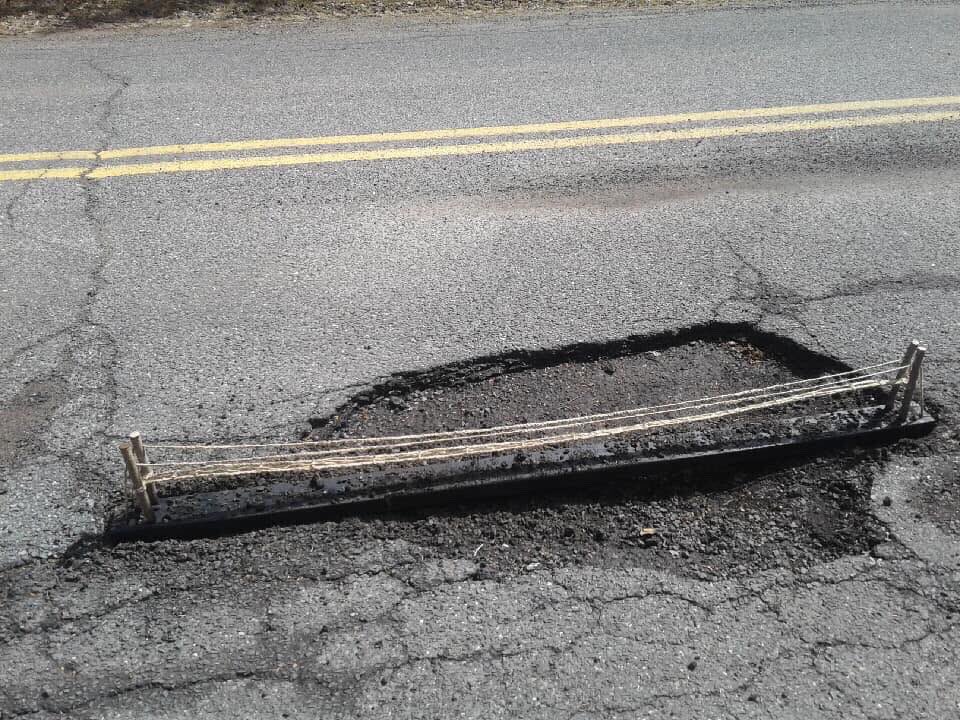 NickJohnston101's tweet photo. It’s Pothole Season in the Great Northeast!
A viewer sent me these photos from the Berkshires. Local residents used some creative ways to draw attention to the problem; rubber duckies, warning cones, and ultimately - A Draw Bridge!
How about YOUR neighborhood?? https://t.co/obWzIwIRNn