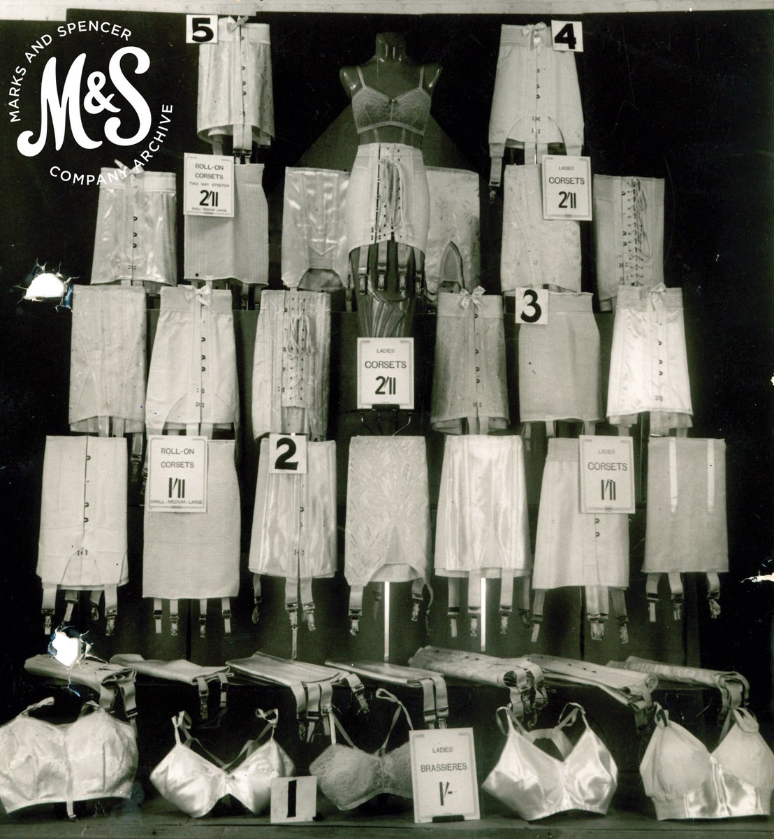 MandSHeritage's tweet photo. Quite the display of corsets from 1937! Our corsets were 'designed to ensure perfect fitting' and by 1937 also included 'fancy roll-on corsets' with 2-way stretch #1930s #corsetry https://t.co/uS6FAoTLIA