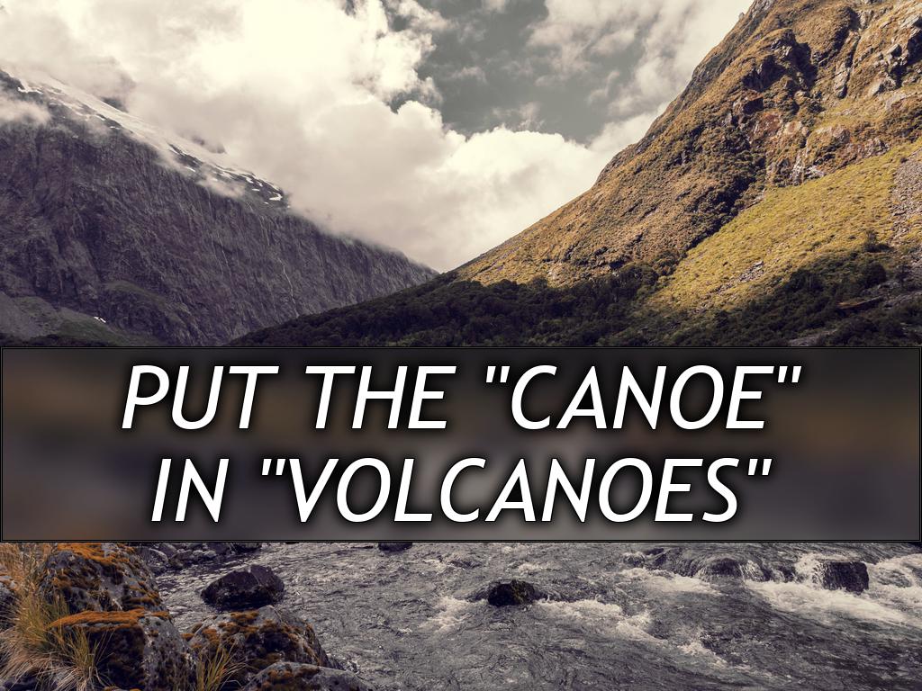 A small bend in a stream with a few rocks and churning water, at the bottom of a deep valley with sheer rock on one side and grass on the other