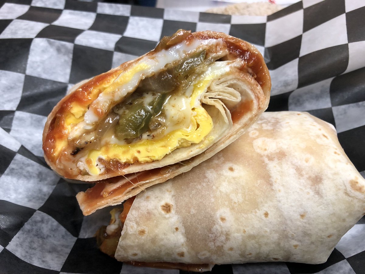 Fajita Burrito ~ 3 eggs, cheese, sautéed onions and peppers in fajita seasoning and salsa.