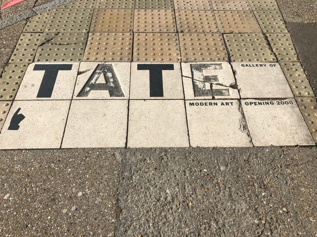 Tate sign looking a bit Tatty. Having said that we can't believe <a href="/Tate/">Tate</a> Modern only opened in 2000. We can't imagine #Bankside without it.