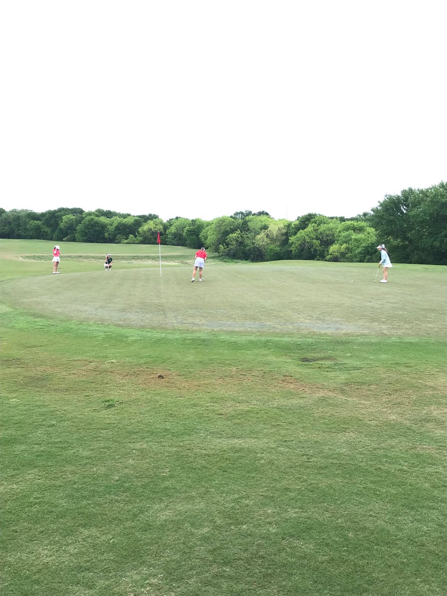 The final foursome of NEISD golfers putting on the 14th green during the final day of the District 27-6A Golf Championships at The Republic.