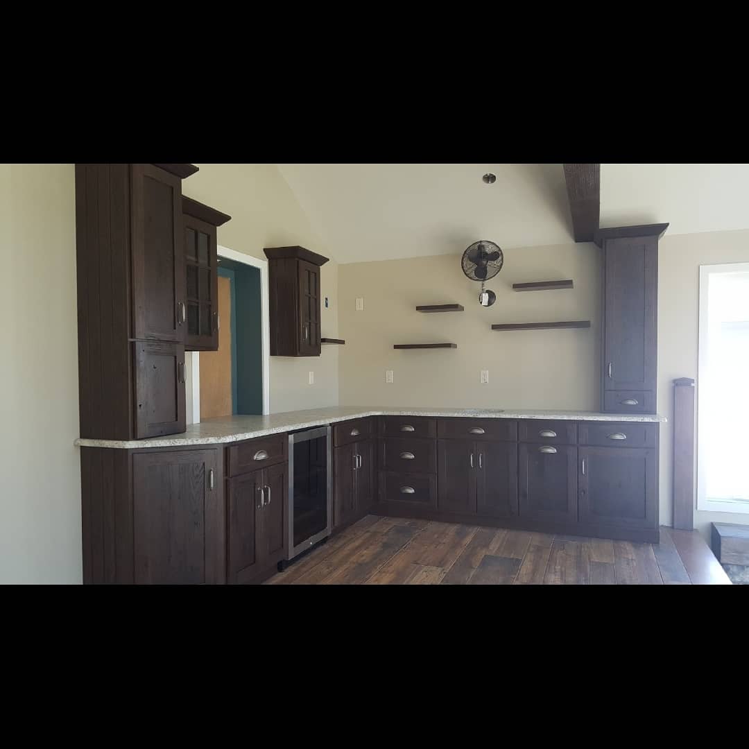 CreationCabs's tweet photo. This updated loft space includes Weathered Hickory cabinets with 'Walnut' stain, a small bar sink, a beverage cooler, and 5 floating shelves https://t.co/zAgljqintL