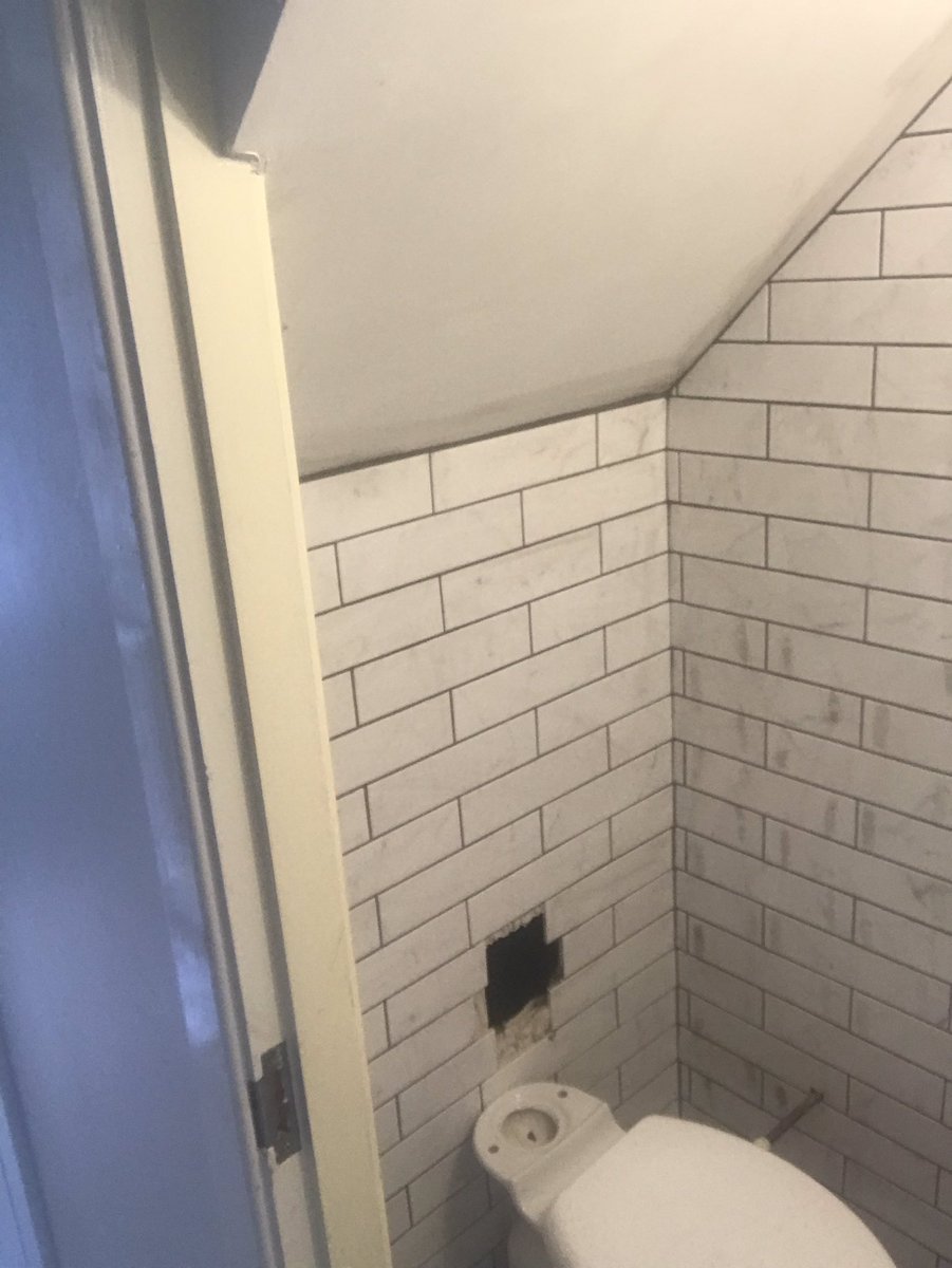 wall_pc's tweet image. Little under the stairs toilet completed with lovely marble effect ceramics and @UltraTileFix grout.