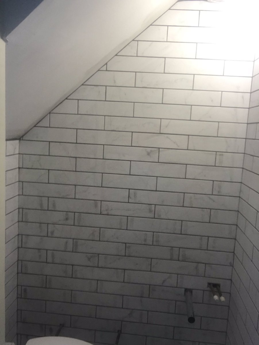 wall_pc's tweet image. Little under the stairs toilet completed with lovely marble effect ceramics and @UltraTileFix grout.