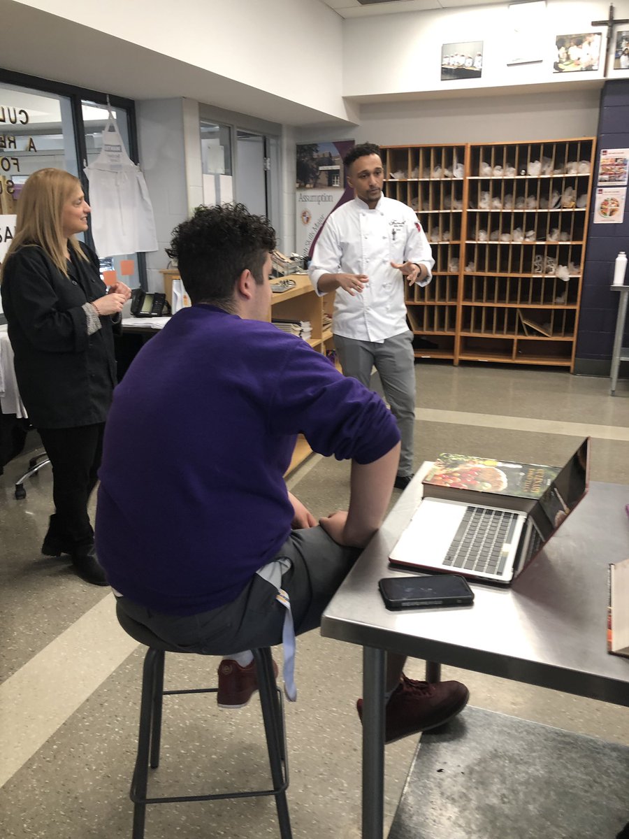AssumptionH's tweet photo. Former Assumption SHSM Culinary student Chef John Ennis speaking to our students about this wonderful profession @WECDSB @FairmontRYH https://t.co/3nQFz3tcCW