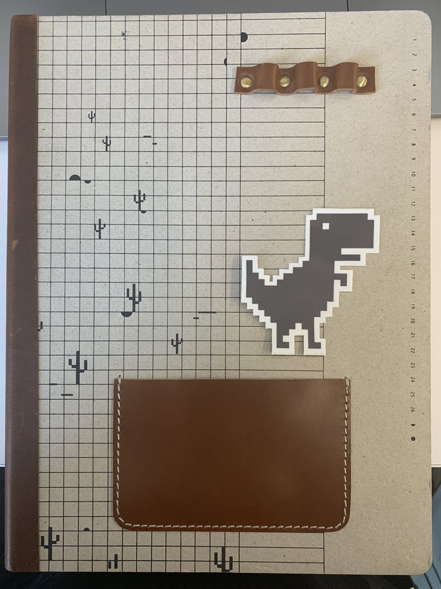 A notebook with cactus graphics.