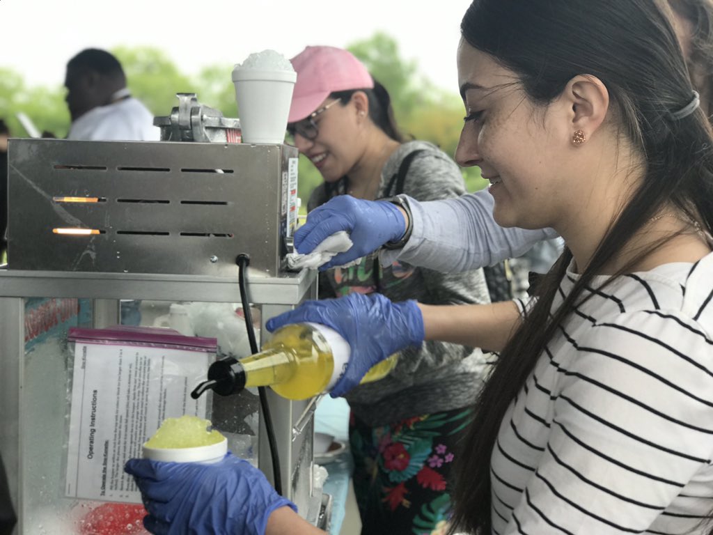 Our Secretary @daniellaaldaco showing off her snowcone making skills at #TAMUSA10FEST. 🍧