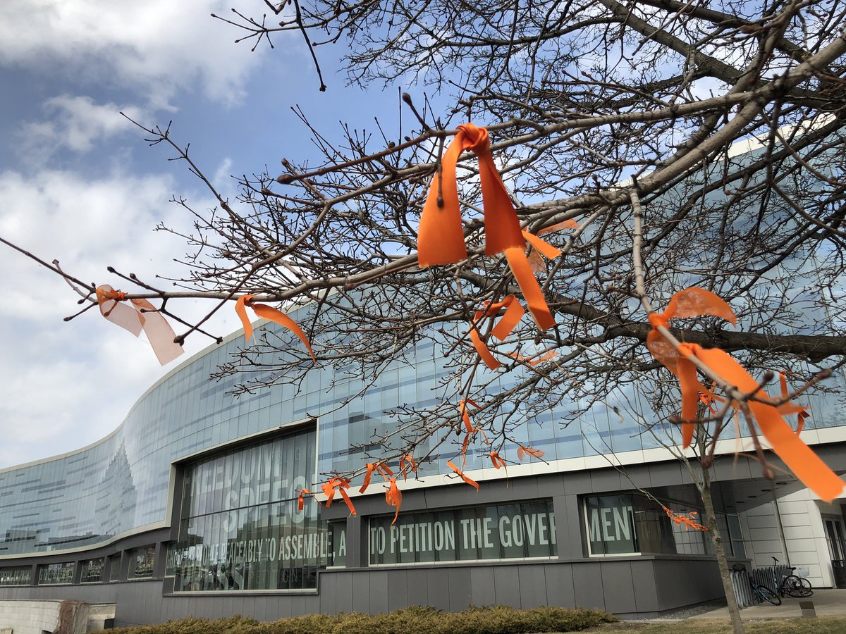 Commemorative orange ribbons were tied to the trees outside of <a href="/NewhouseSU/">Newhouse School</a> to honor the life and impact of Dean Lorraine Branham.