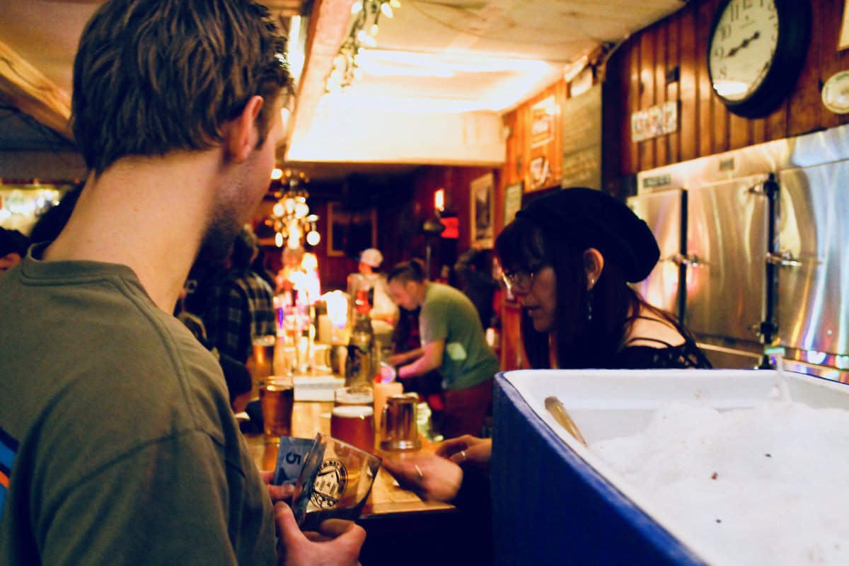 An action shot behind the bar at The Arlington