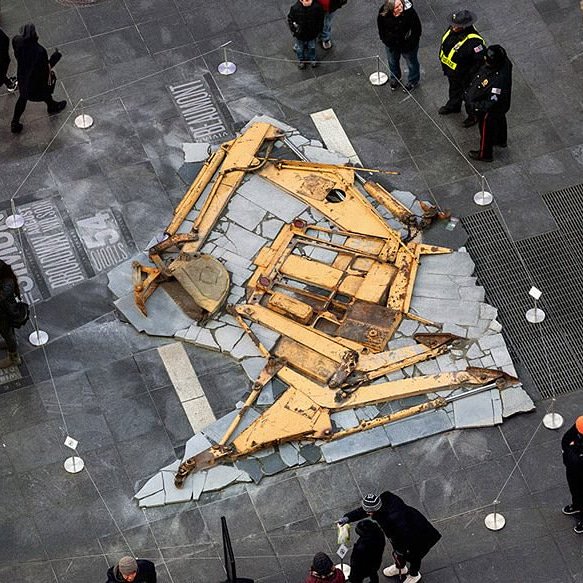 "Zelehoski and morales depict a fossilized dinosaur from a deconstructed backhoe in New York"
Image taken from designboom

#therapture is a monumental sculpture made by artist #michealzeheloski and curated by #chemorales in New York Time square.