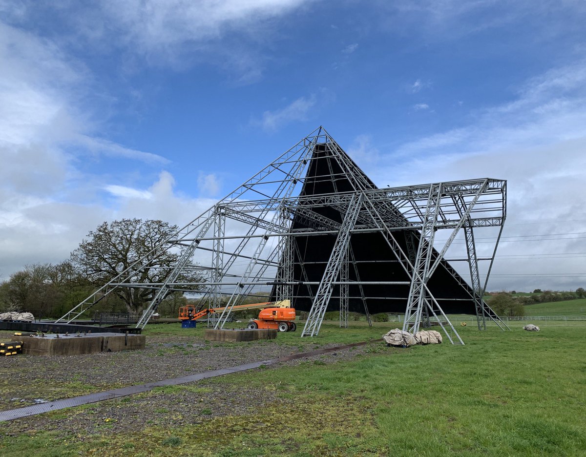 glastonbury's tweet photo. 83 days until #Glastonbury2019 opens, and the Pyramid frame is getting dressed… https://t.co/yl9JEJTUfs