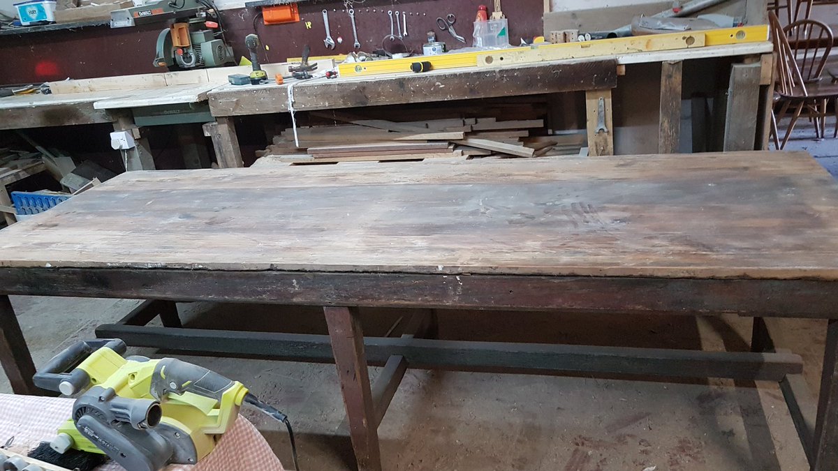 Reclaimed2's tweet image. 9ft workbench bought to me with a ply top, ply ripped off to reveal oil stained, paint covered pine top. Frame tightened and stretcher repaired, top stripped back and finished with a rustic pine wax, available now #tablerenovation