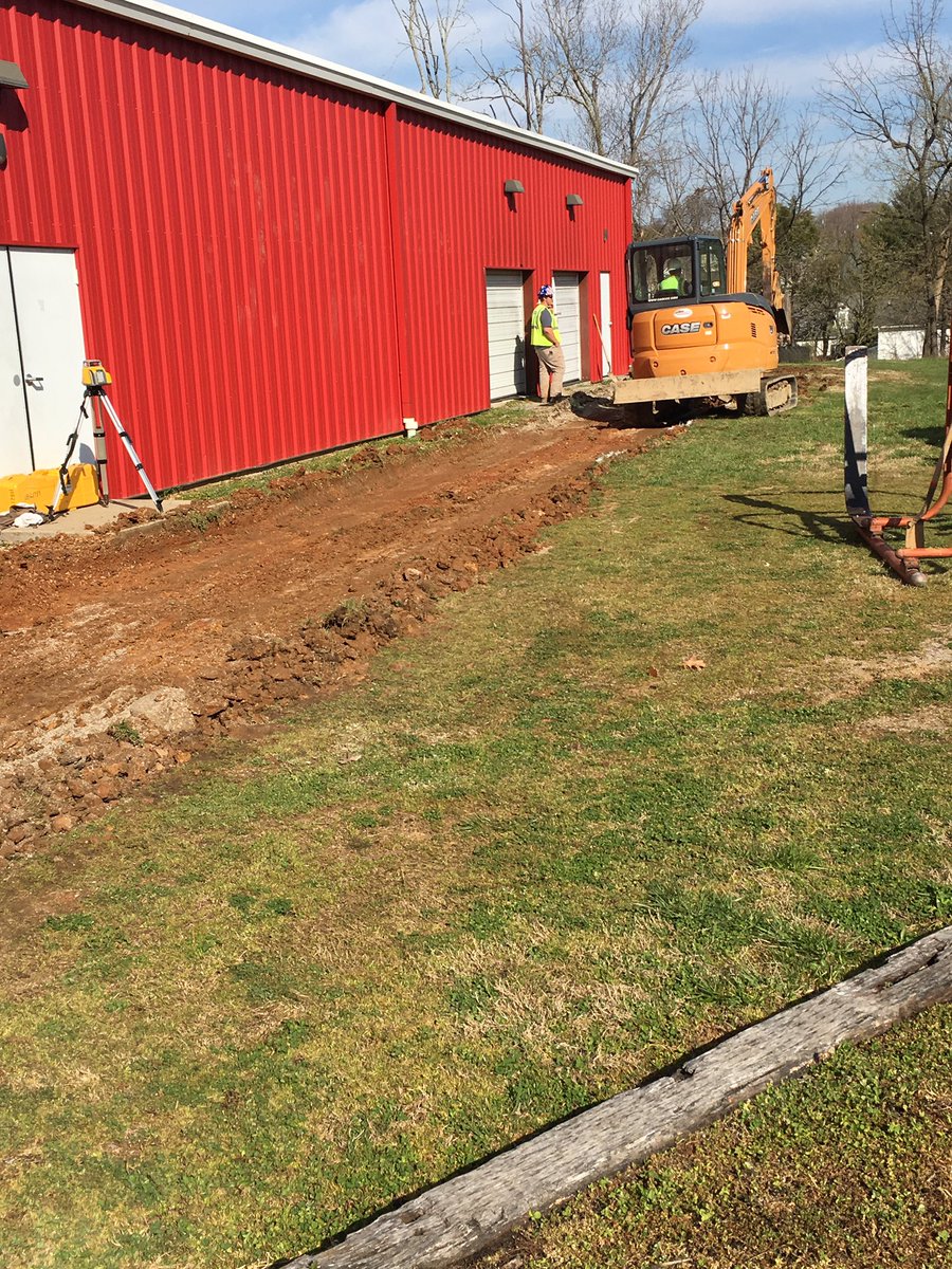 HallsRedDevils's tweet photo. Next project is underway. Thank you Hurst Excavating. 12 foot concrete pad being installed along entire front of fieldhouse. Amazing what can be done with such great people in this community. #DevilRising https://t.co/KPlwxSEdIB