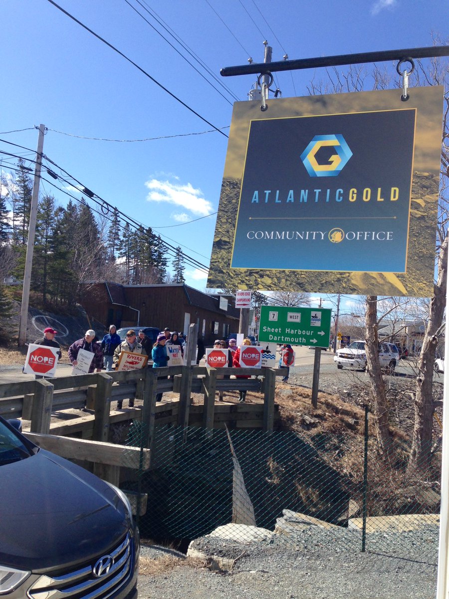 EACwilderness's tweet photo. Happening right now. Over 50 protestors at opening of Atlantic Gold's new "community relations" office in Sherbrooke, #NovaScotia. The community is speaking: No open pit gold mine next to St. Mary's River! NOPE! 👎
#nspoli #cdnpoli https://t.co/q1hDCgZue3
