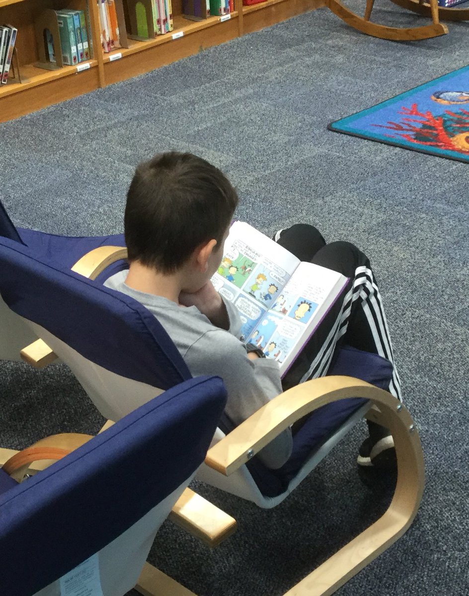 LESReading24's tweet photo. Enjoying print and digital books in the library. #bvlibraries @LESReading24 #WeAreFamilyLES https://t.co/1uszj0UWFS