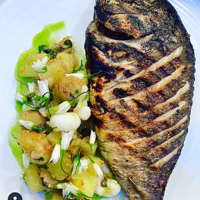 Tonight's fish special @deanesmeatlocker . Asador grilled whole break with warm potato salad, leek flowers and portavogie prawns. Bringing a little Mediterranean flavour to Belfast. #wealsodofish #lovedeanes #meatlocker #epicflavour #meatyfish #welovewha… ift.tt/2FQyCzo