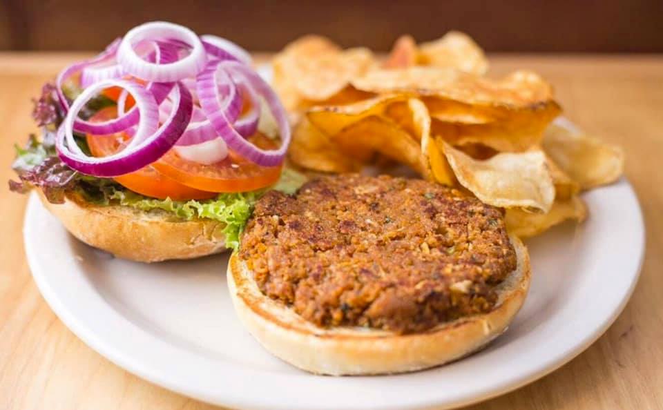 HeartlandCafe's tweet photo. Heartland’s Greatest Hits- our Seitan Burger. A top notch vegetarian’s dream! Look at those house made chips! https://t.co/01mVmDtnK9