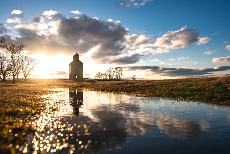 SDMagazine's tweet image. An elevator near Nunda reflected in spring snowmelt. Photo by Jeff “Doze” Halbritter. #PhotoFriday