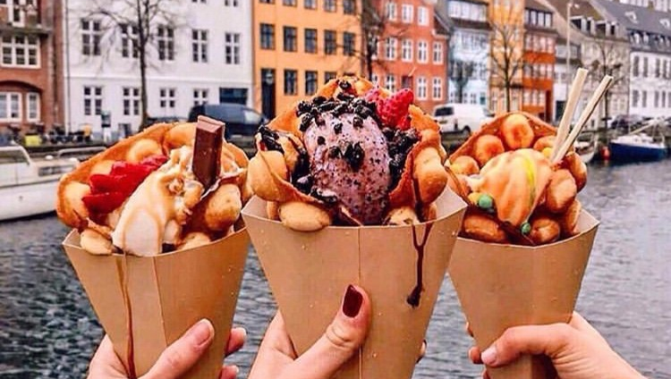 TravelexIntl's tweet photo. #TGIF! Cheers with bubble waffles from Copenhagen, Denmark! The city of Copenhagen is nearly a thousand years old! It began as a simple fishing village and is now the most visited city in Scandinavia. 📷@polabur
#travelgoals #icecream https://t.co/0wOcZZRLjl