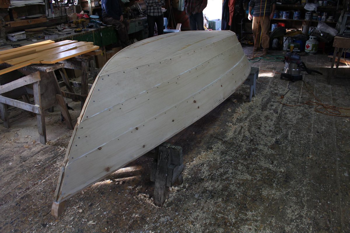 DoryShop's tweet photo. The building of a dory in 10 days - end of day 8, capping & thwarts painted and ready to go, dory flipped.. #dory #doryboat #woodenboat #buildingaboat #Lunenburg #day8 https://t.co/rce4CK4Vl3