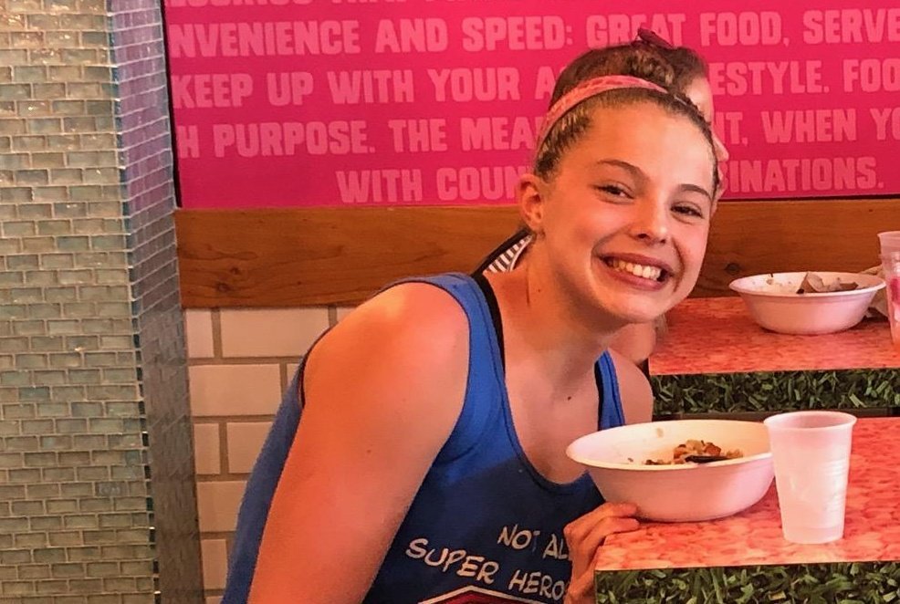 RadnorAquatic's tweet photo. Girl needs fuel to swim soooo fast! Taylor chows down after going her first ever 57 in the 100 fly! #RADswim #NeverForgetToSmile https://t.co/0JfXtqtyfq