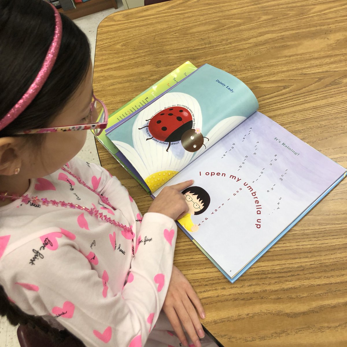 MsHolleger's tweet photo. “Ms Holleger, look at this! This poem is perfect for today because it’s raining and it’s about rain!!” I love it when students independently explore our topics and get to share what they notice with the class! #poetry #shapepoems #firstgradequotes @EllisSoars https://t.co/Gxkaqa01KJ