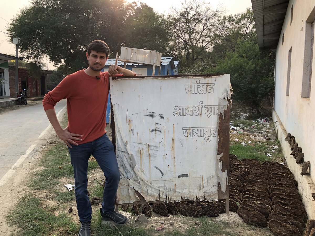 dhruv_rathee's tweet photo. Welcome to Modi’s Ideal Village 

- Gobar besides the entry sign
- Garbage Dump behind 
- Inside look of the Swach Bharat Toilet 

This is the reality of Vikas for you.

#ModiHainTohMumkinHain https://t.co/1ljbSfUz7W